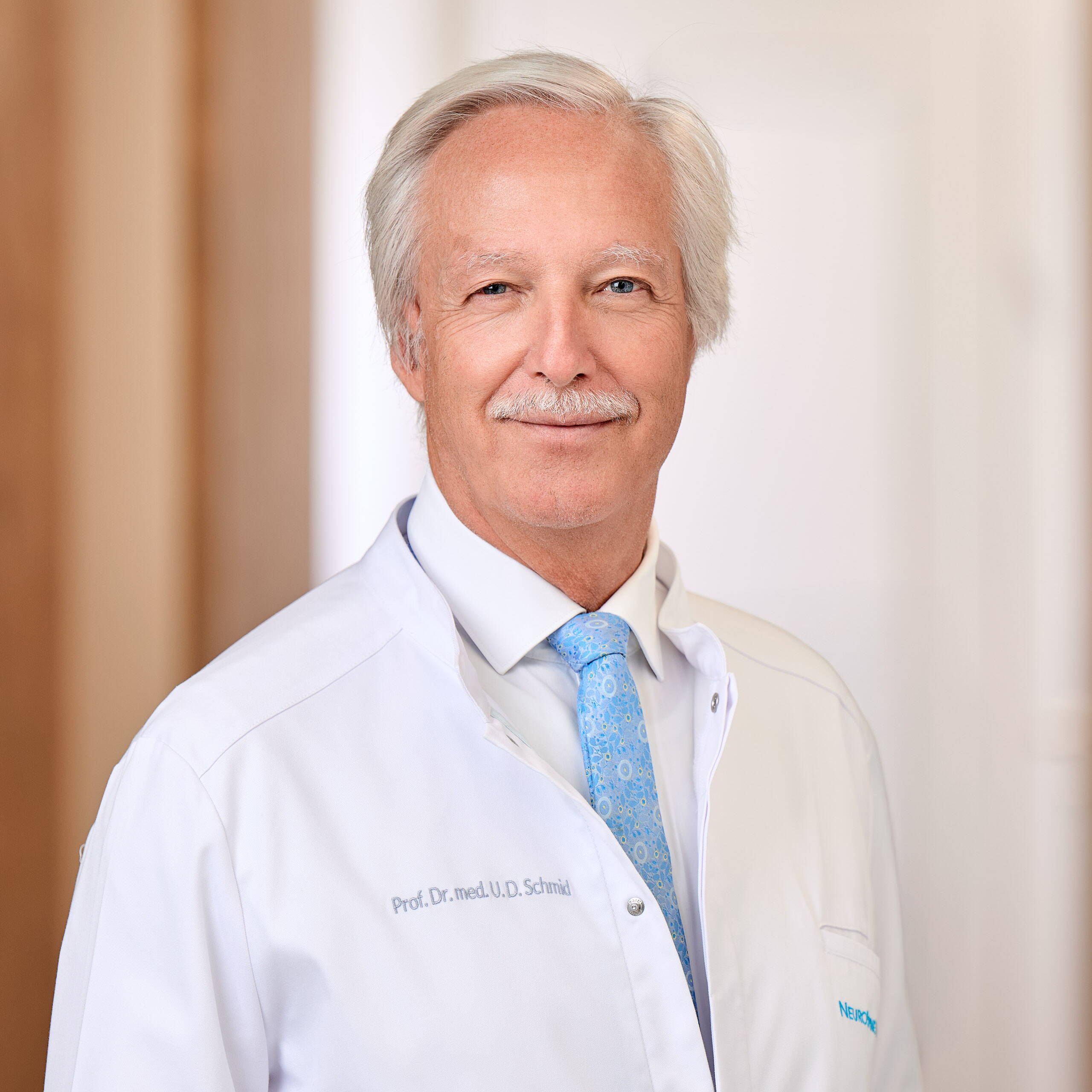 Portrait photo of Prof. Urs Dieter Schmid, Neurosurgery consultant at NeuroSpineZürich